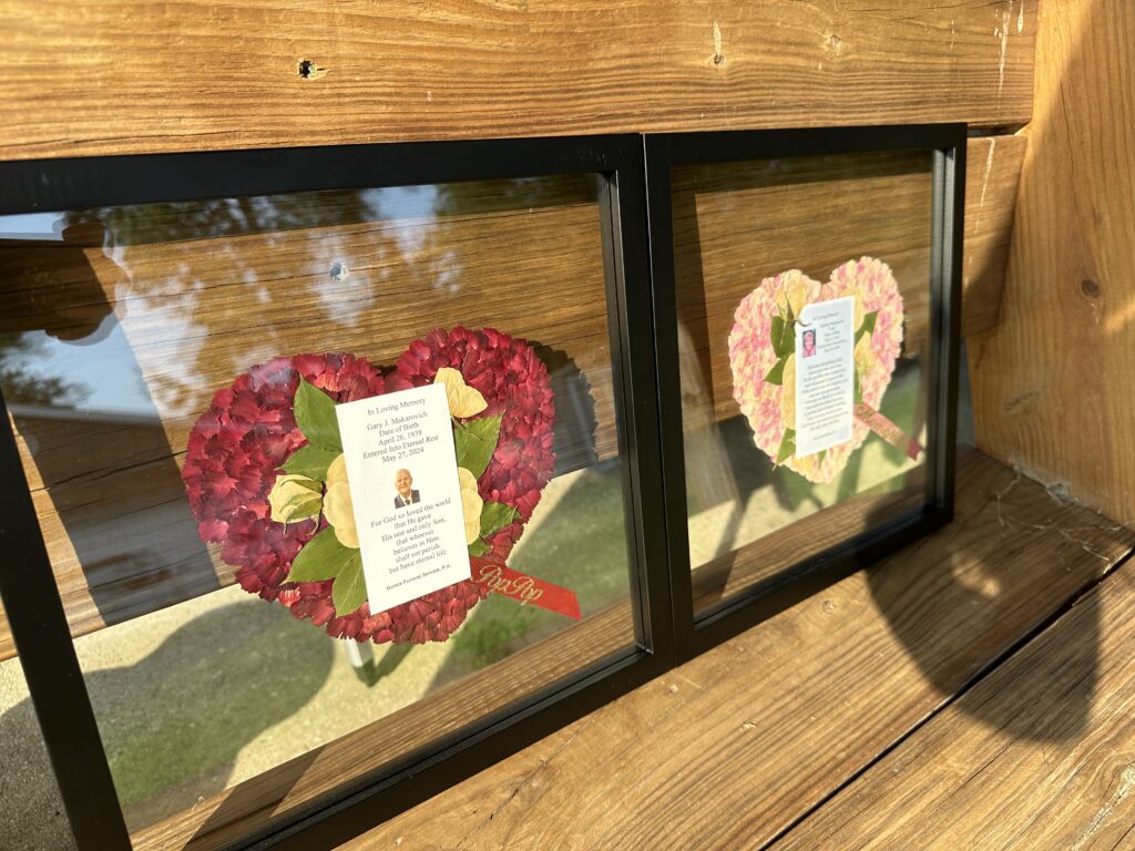 two black square float style frames with red and pink hearts including memorial cards