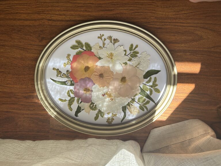 Pressed flowers in oval frame
